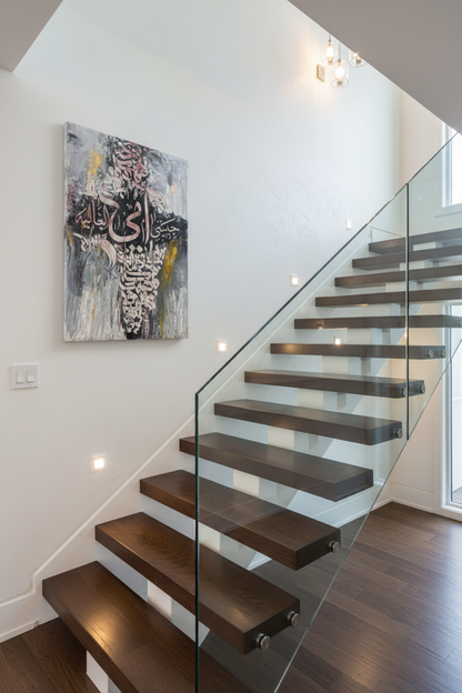 Silver and rose Islamic calligraphy canvas mounted on staircase wall in elegant home interior