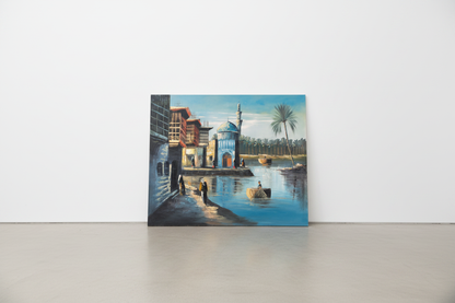 Original Middle Eastern riverside mosque oil painting leaning against a white gallery wall — frameless canvas display