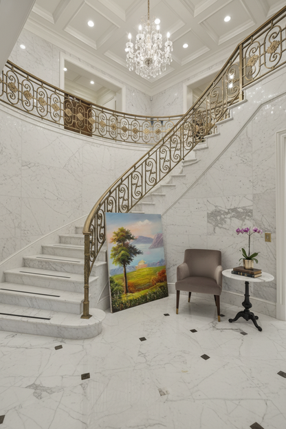 Golden meadow landscape oil painting leaning near marble staircase in an elegant luxury home
