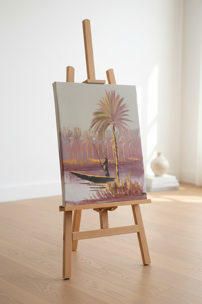Original riverside palm and fisherman oil painting displayed on wooden easel stand in bright modern interior