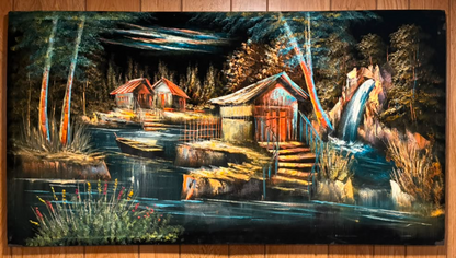 Forest waterfall cabin night scene canvas wall art – original painting with red-roofed cottages, dark river, cascading waterfall, colorful ribbon streamers on birch trees, and wildflowers