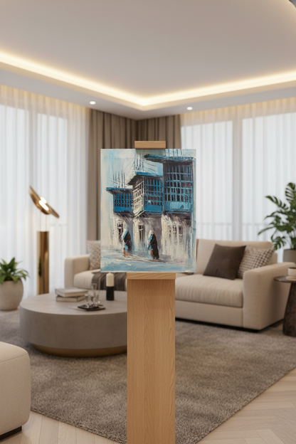 Blue balconies old town street oil painting displayed on a wooden art stand in a modern living room – no frame