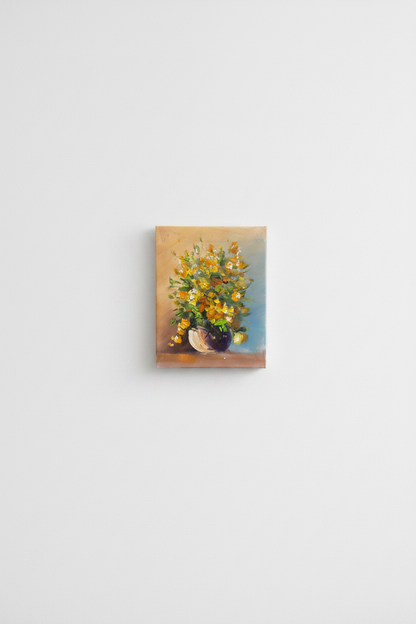 Original yellow floral bouquet impasto oil painting displayed unframed on clean empty white wall