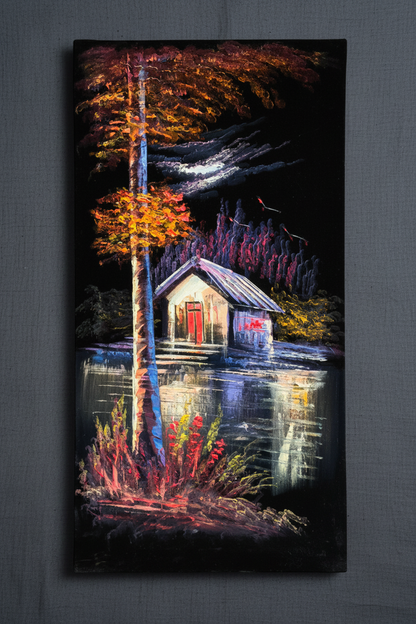 Lakeside cabin painting displayed on slate grey linen wall