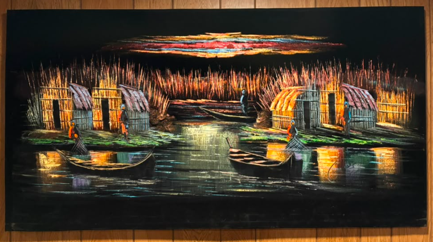 Iraqi marshland fishing village scene canvas wall art – original painting with traditional mudhif reed huts, fishermen casting nets from wooden boats, golden reed grass, and multicolored sunset sky